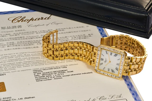 Chopard Ref. 14-3347-YDB, mother-of-pear dial, diamond-set bezel, integrated bracelet; 18K