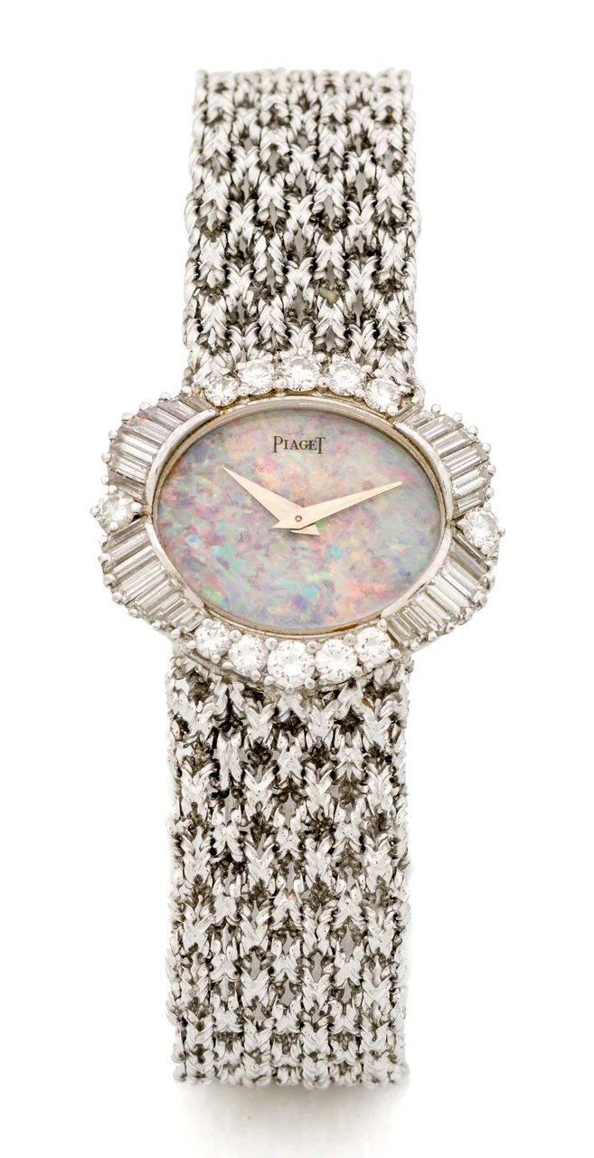 Piaget PIAGET, REF. 624, OPAL AND BAGUETTE DIAMONDS, WHITE GOLD A fine and rare manual wind, 18k white gold and baguette diamonds wristwatch with opal dial. kol saati