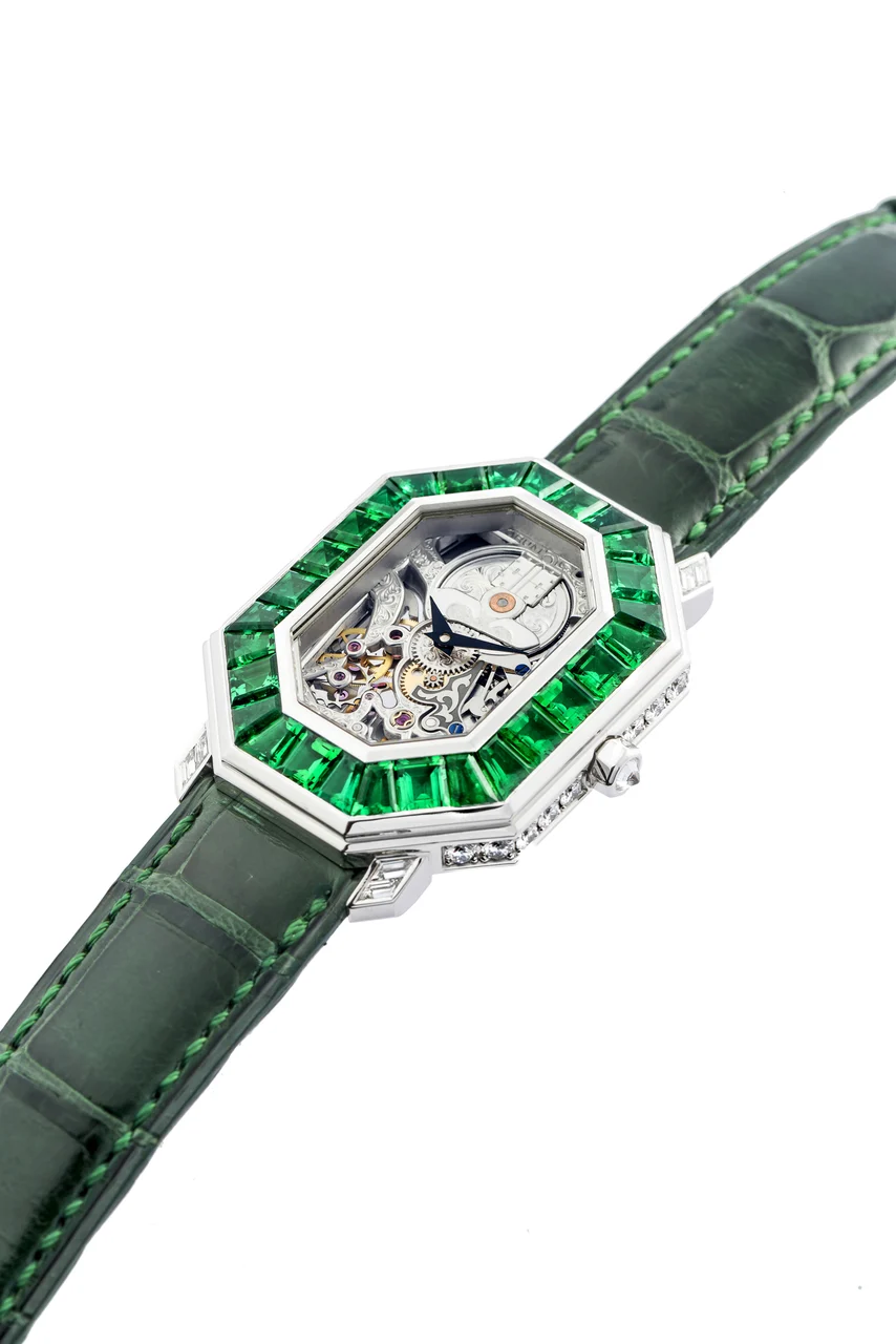 Corum CORUM REF. 257.102.69 WHITE GOLD DIAMONDS AND EMERALD Very fine and elegant, manual-winding, 18K white gold diamond and Emerald-set wristwatch with hand-engraving skeletonized movement. kol saati