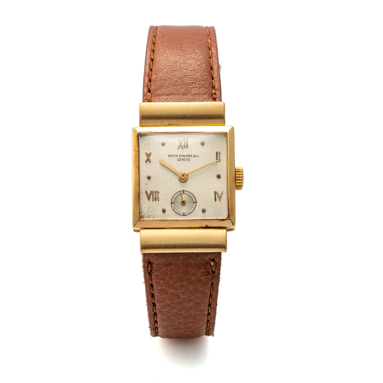 Patek Philippe Ref. 559, rectangular-shaped, hooded lugs; 18K yellow gold kol saati