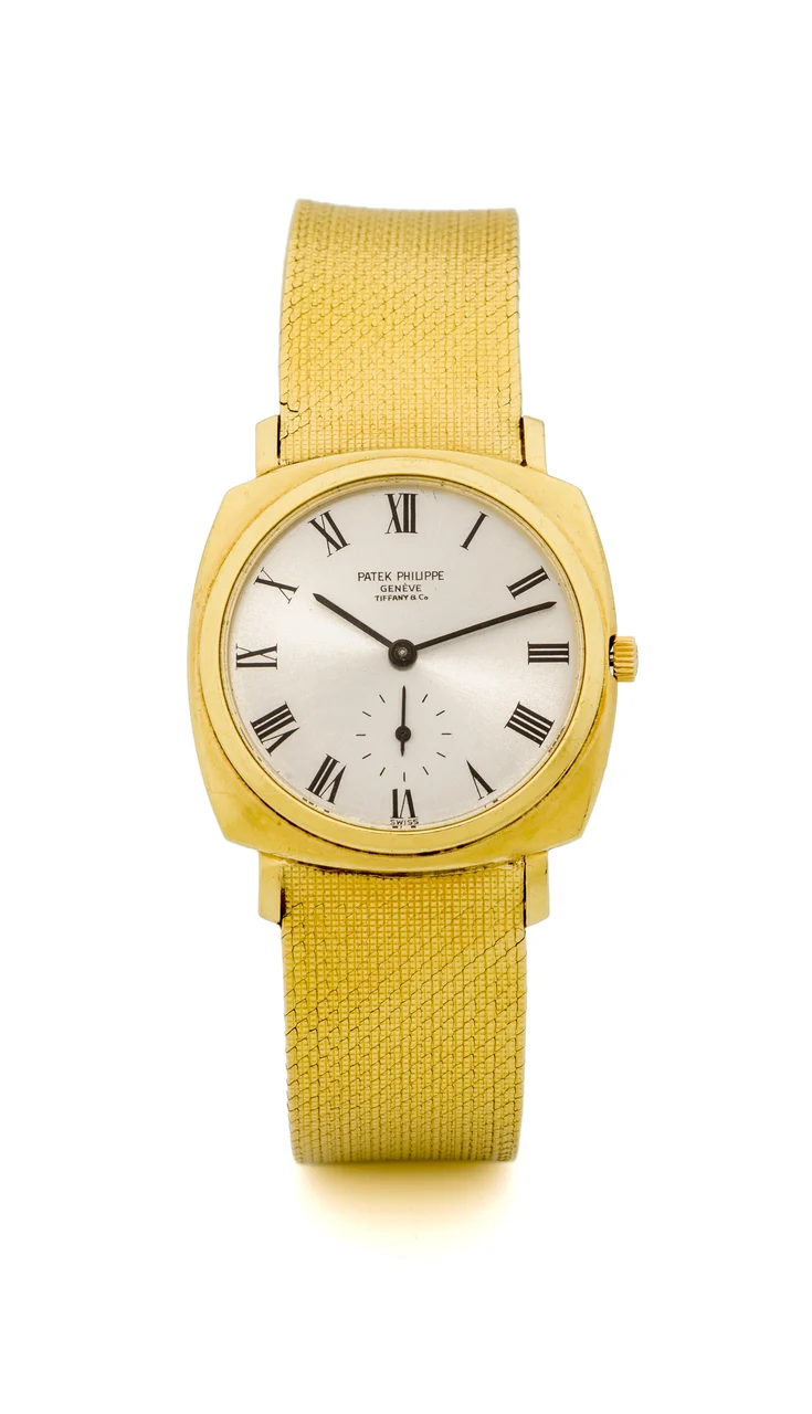 Patek Philippe PATEK PHILIPPE REF. 3525 YELLOW GOLD PERSONALIZED BY TIFFANY & CO. Very fine and Extremely rare, cushion-shaped, self-winding, 18K yellow gold wristwatch. kol saati