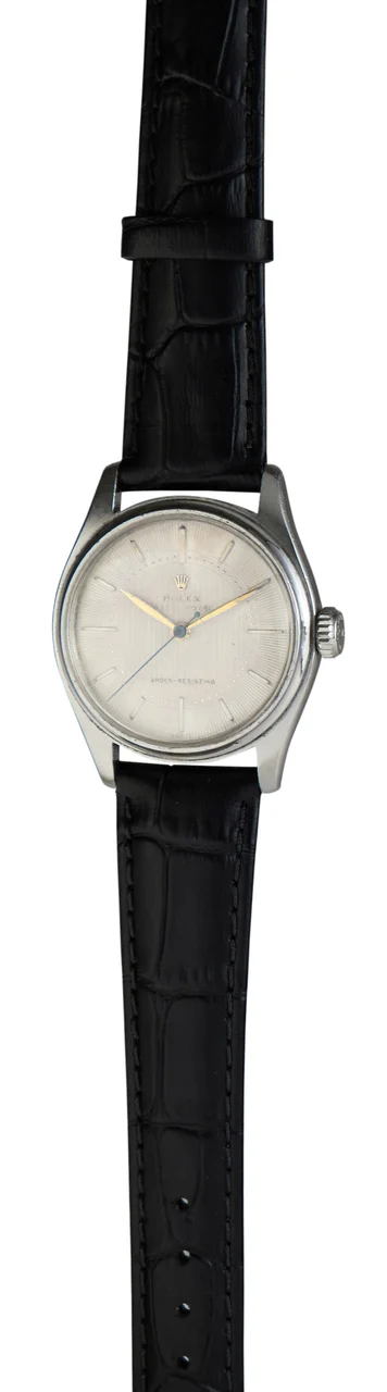 Rolex Ref. 6044, centre-seconds, guilloché (engine-turned) dial; “Oyster” “Royal”; stainless steel kol saati