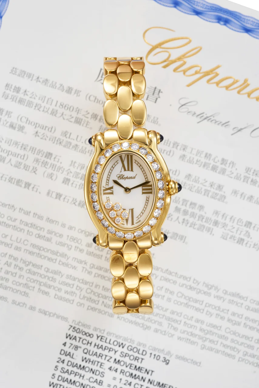 Chopard Ref. 27-7466-23-11-YDBL, mother-of-pearl dial with moving diamonds, diamond-set bezel, cabochons sapphire-set lugs and crown, integrated bracelet; “Happy Sport”; 18K yellow gold, diamonds and sapphires (“ ”) kol saati