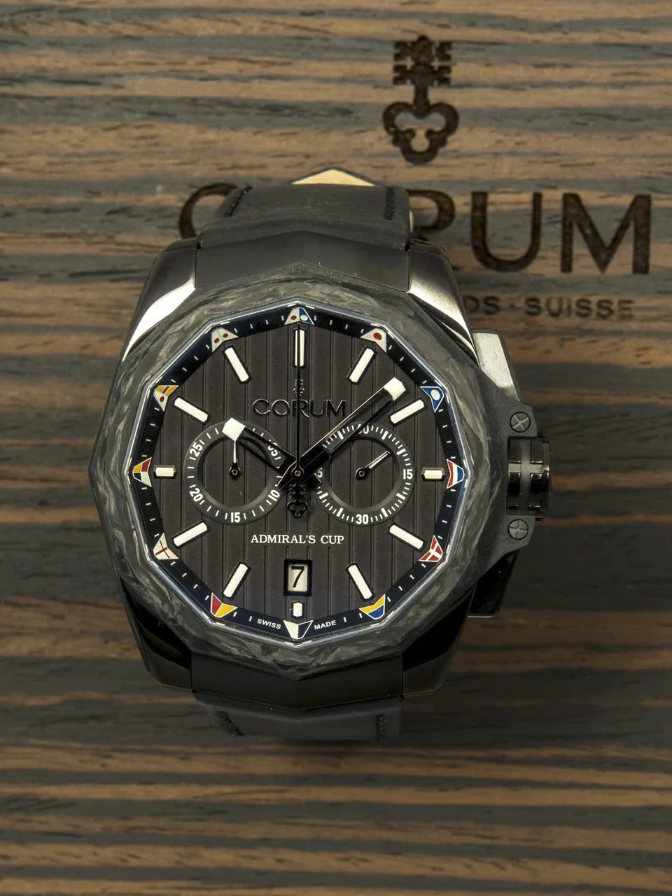 Corum Admiral'S Cup Ac-One CORUM ADMIRAL'S CUP AC-ONE REF. 01.0116 CHRONOGRAPH PVD COATED AND CARBON A fine self-winding PVD coated stainless steel and carbon wristwatch with chronograph and date. kol saati