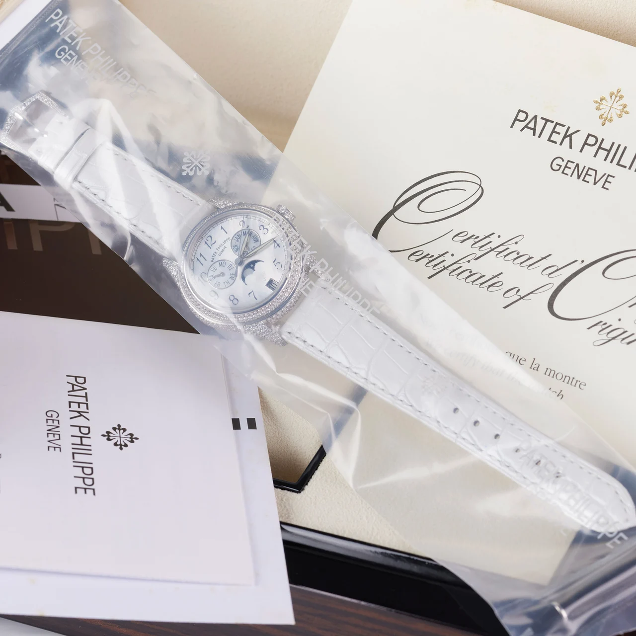 Patek Philippe PATEK PHILIPPE REF. 4937G-001, ANNUAL CALENDAR, 18K WHITE GOLD, DIAMONDS CASE 3.23 CT, SINGLE SEALED kol saati