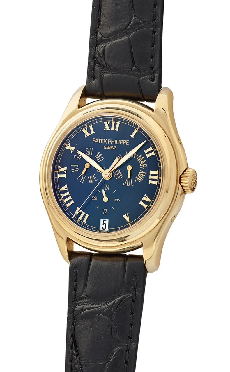 Patek Philippe PATEK PHILIPPE REF. 5035J, ANNUAL CALENDAR WITH BLACK DIAL, 18K YELLOW GOLD, WITH ORIGINAL PP WARRANTY AND PP TRAVELLING LEATHER POUCH kol saati