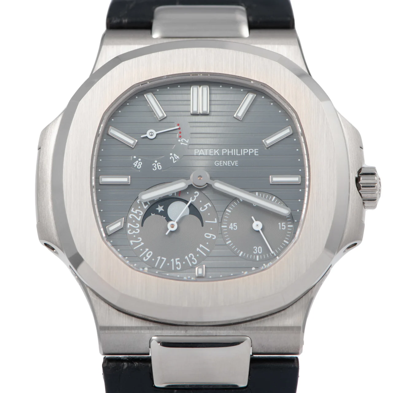 Patek Philippe PATEK PHILIPPE REF. 5712G NAUTILUS WHITE GOLD Very fine and rare, large, carré galbé, self-winding, water-resistant 18K white gold wristwatch with date, moon phases, power-reserve indication kol saati